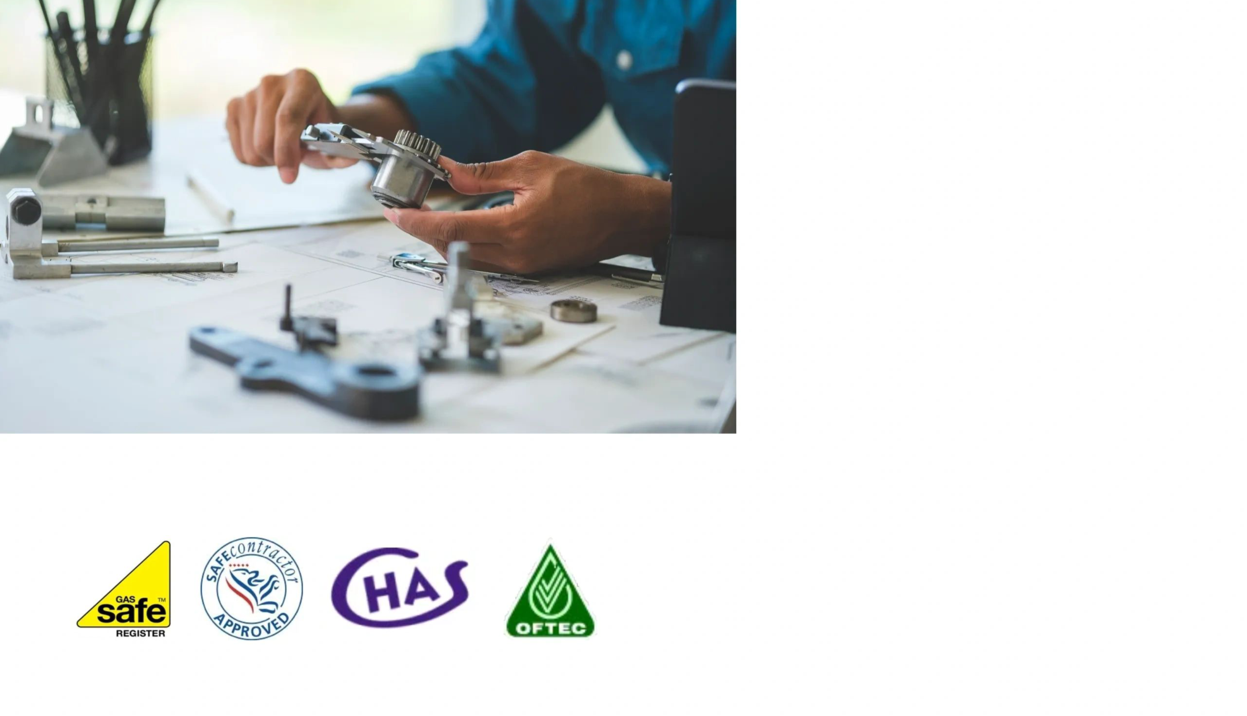 Engineer reviewing technical drawings and industrial components